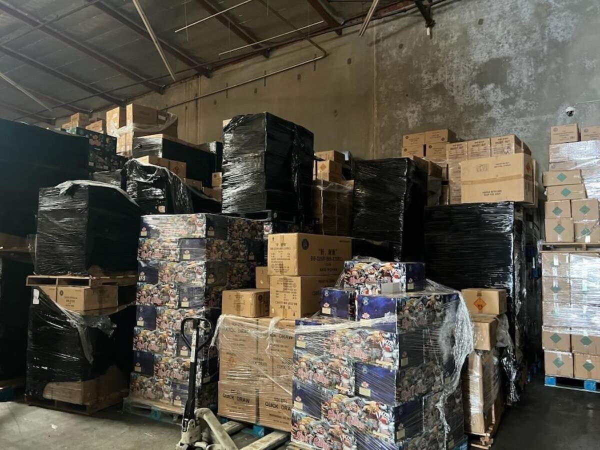 Fireworks seized by state and federal authorities during a May 21, 2025, in Commerce, California. The brown boxes in the center of the photograph are “Quick Draw” fireworks, which contain more than 500 grams of explosive material and are illegal in California, according to fireworks experts who spoke with The Bee.